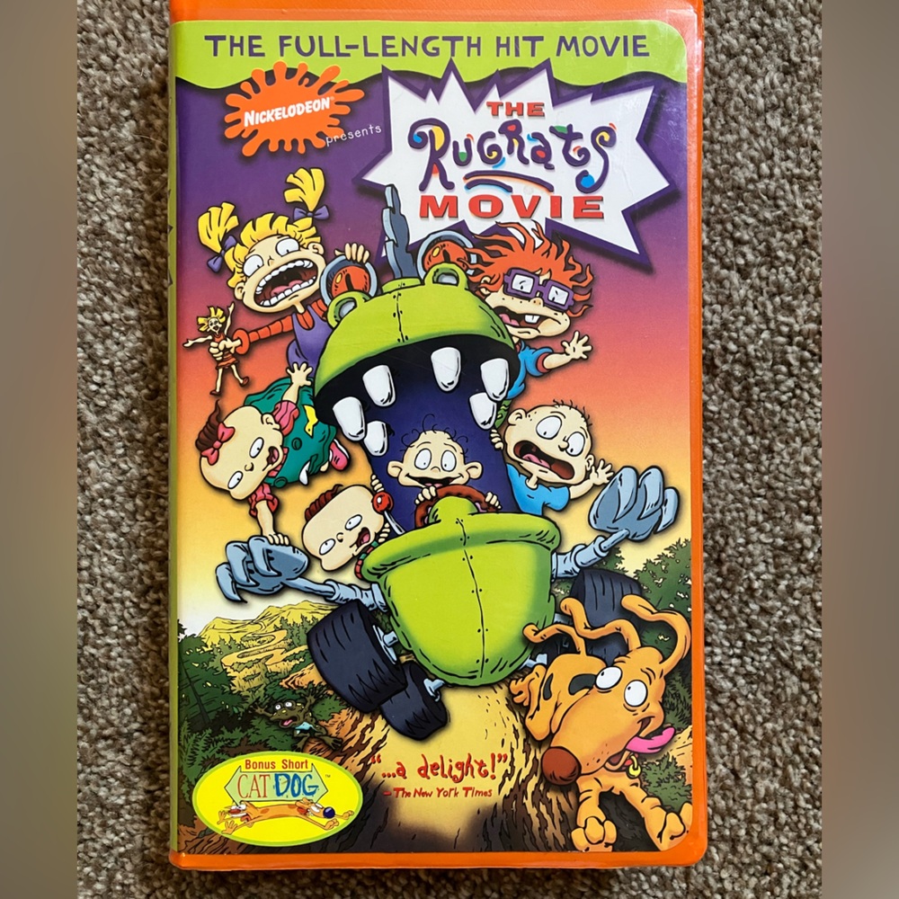 The Rugrats Movie orange VHS tape with bonus clips
